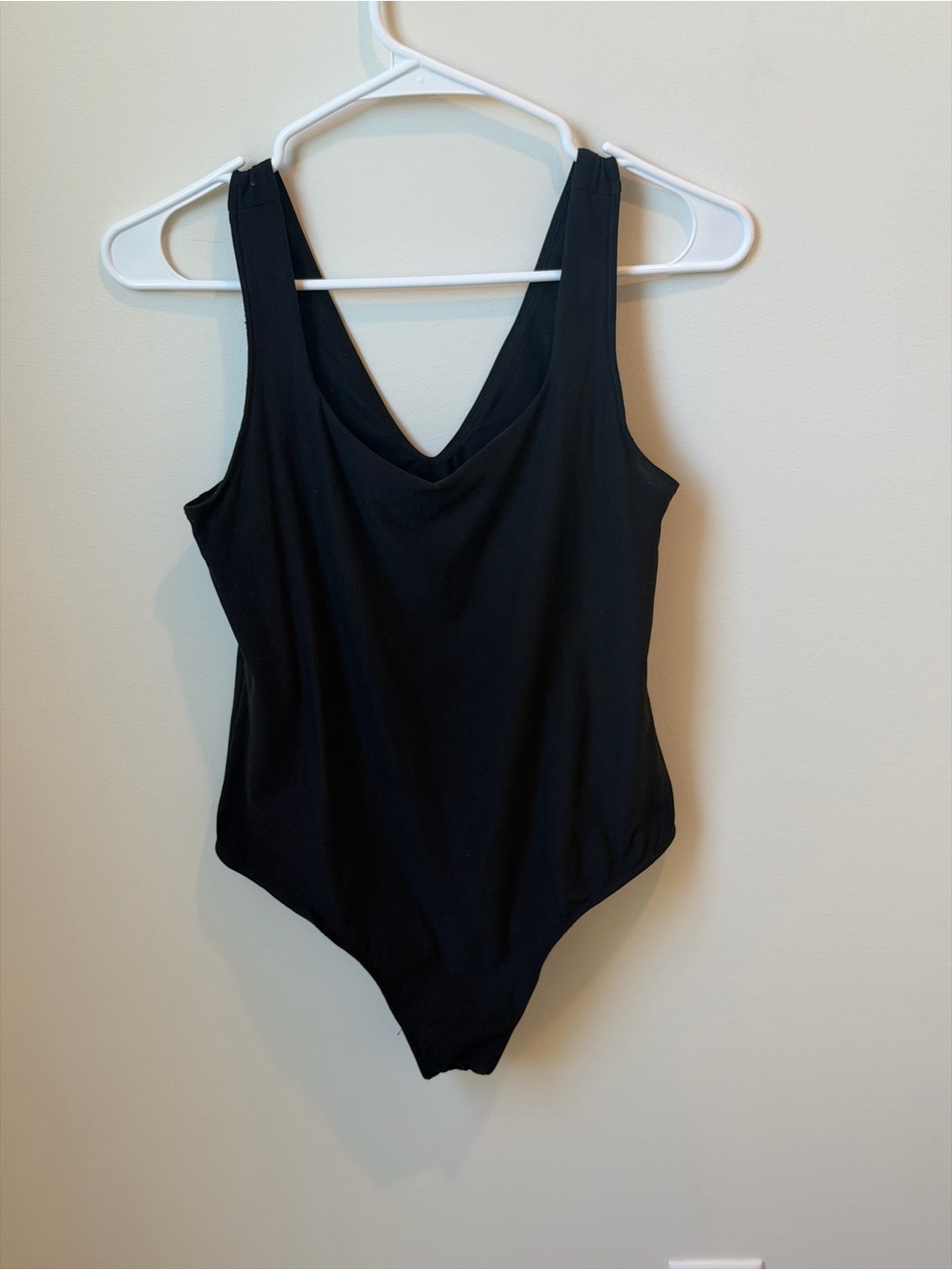 Women’s one piece black bodysuit from a boutique